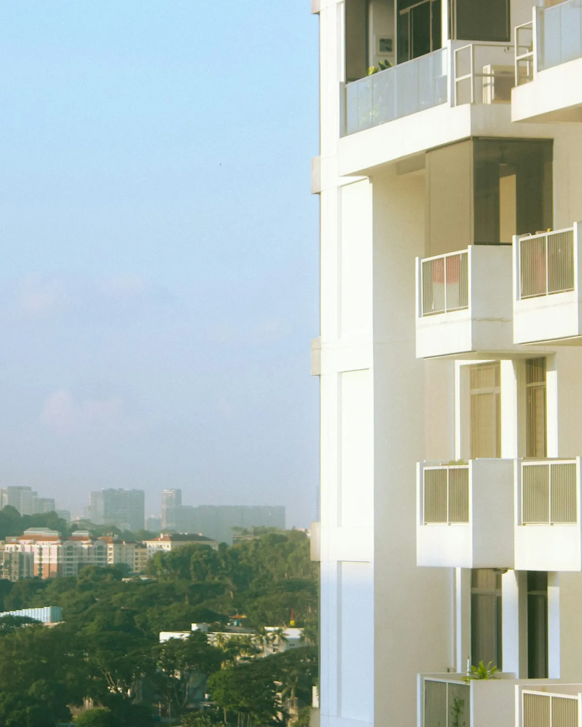 Modern Singapore private condominium with balconies, Ivan handles condo and HDB sales